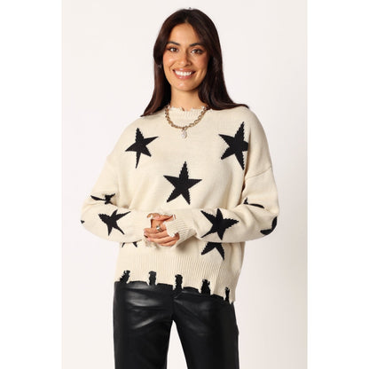 Knitted sweater with star print and distressed edges